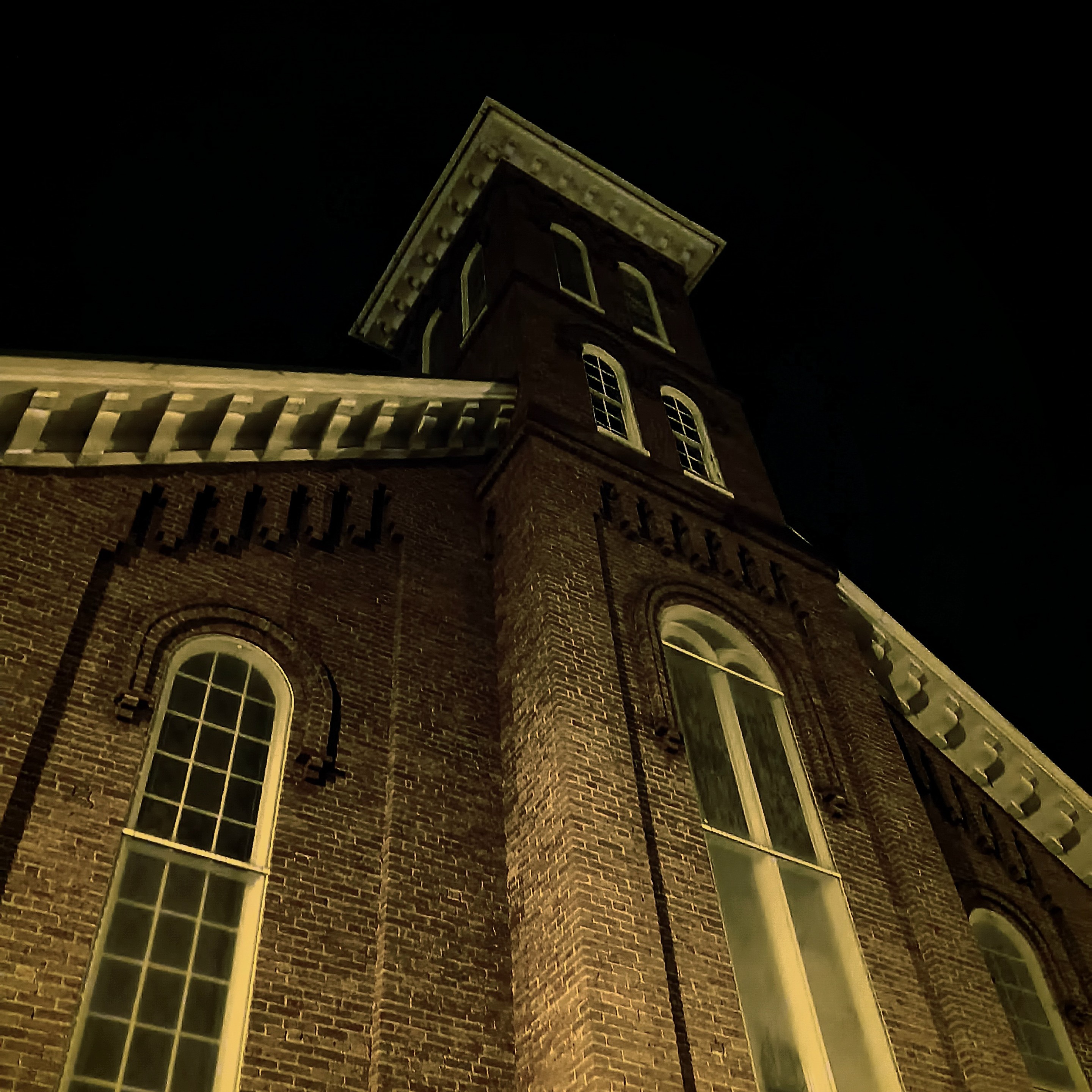 another tall church, made with bricks this time, lit from the bottom in the night