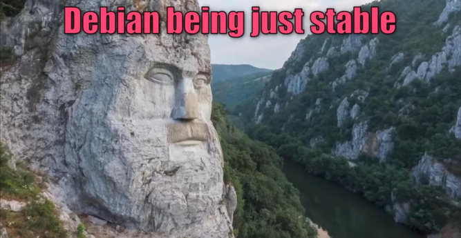 Giant stone face carved into a cliff, overlooking a river and forested mountains. Text reads "Debian being just stable," implying reliability.