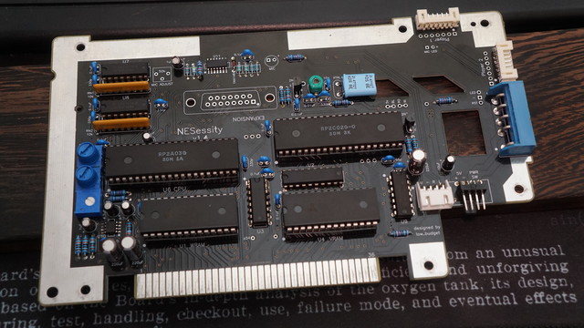 The "fully" populated NESessity v1.4 board with everything installed that was associated with an NTSC frontloader console.  All of the main ICs are in sockets (CPU/PPU/WRAM/VRAM).