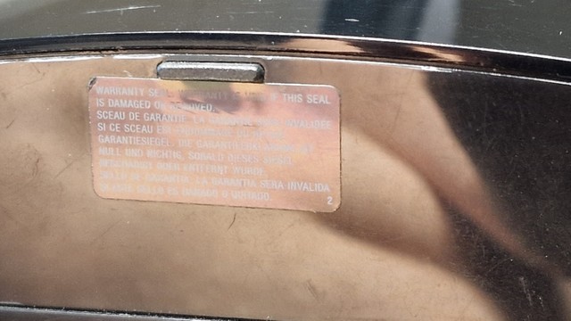 The warranty sticker.
Still not sure about it's originality.