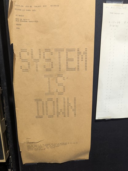Old computer printout reading the system is down.