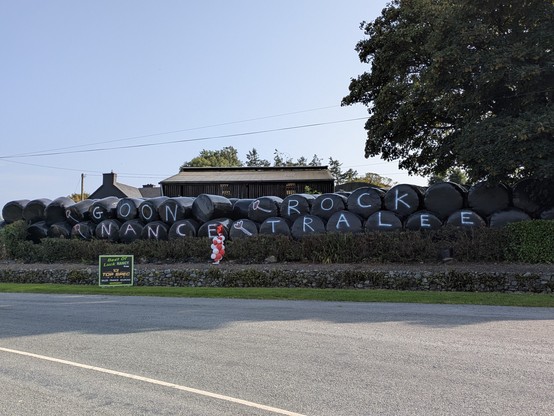 A series of hay bales painted with the words "GOON NANCE ROCK TRALEE" in reference to local belle and Cork Rose Nancy Lehane's entry to the Rose of Tralee competition