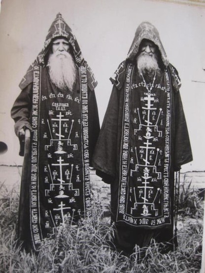 A couple Gandalf-lookin' Ortho schema monks in their dope-ass wizard robes