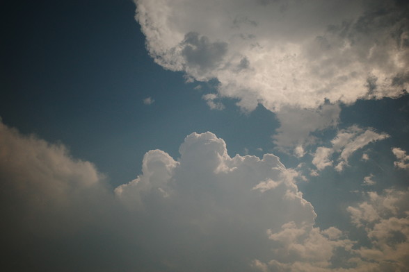 A view of the clouds on top of our house. The sun cast shadows on them, very pretty.