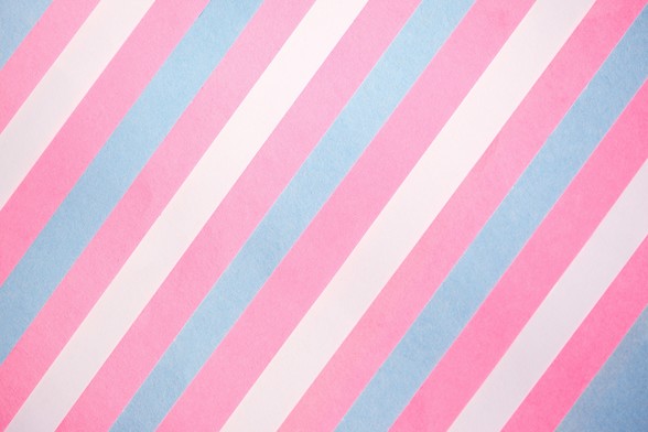 Diagonal stripes alternate between pastel pink, baby blue, and white, creating a soft, calming trans pattern. 