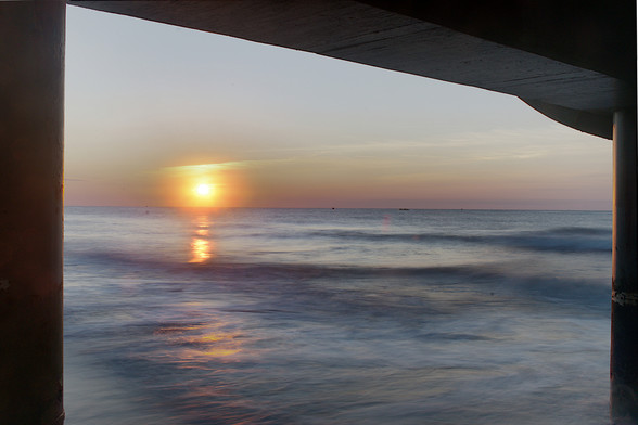 Sunrise captured from underneath the pier at Myrtle Beach, South Carolina