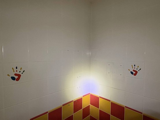 colorful hand stencils on the tile