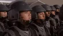 "I'm doing my part" says a helmeted soldier from Starship Troopers 