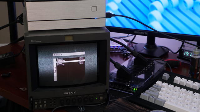 A picture of a Sony PVM-9044 showing the MiSTer screen on the tube with the MiSTer on top of the PVM.