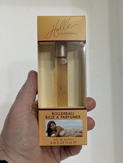 A phial of golden-yellow ichor emblazoned with 'Halle by Halle Berry'