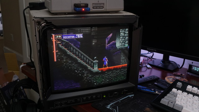 A JVC TM-H150CG showing Castlevania Symphony of the Night running on it.  The front bezel is absolutely shattered, but the image looks great.
