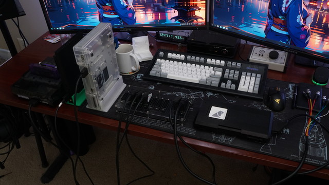 A picture of a SNES, PS1, and PS2 connected to a gwscart switch.  Two outputs are connected, one to a RetroTINK 4K and another to an RGB breakout cable.