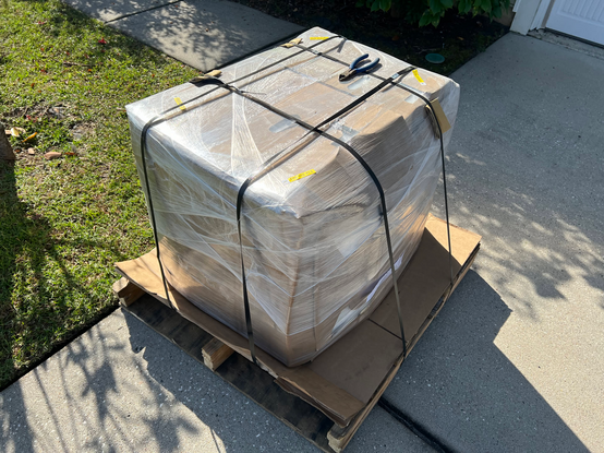 A Sony PVM-2530 packaged up snugly in cardboard, plastic wrap, styrofoam.  It's on a very nice palette as well sitting on the edge of my driveway.