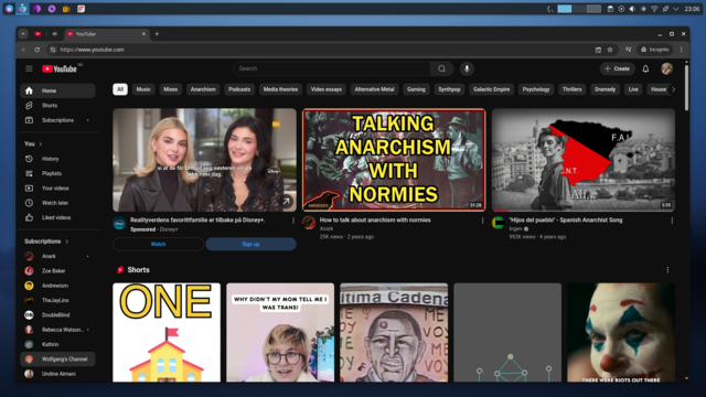 YouTube home page in dark mode, showing video thumbnails with topics like reality shows, anarchism, and various shorts. Vibrant, informative layout.