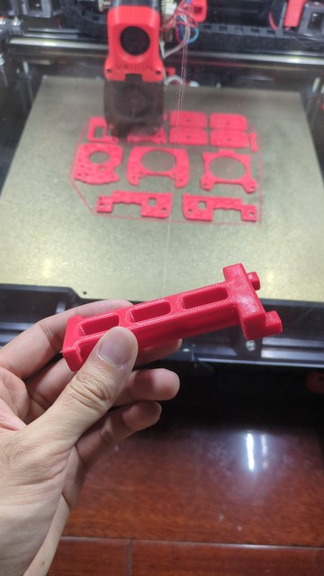 Showing a hard working Voron 2.4 with a functional spool holder in hand