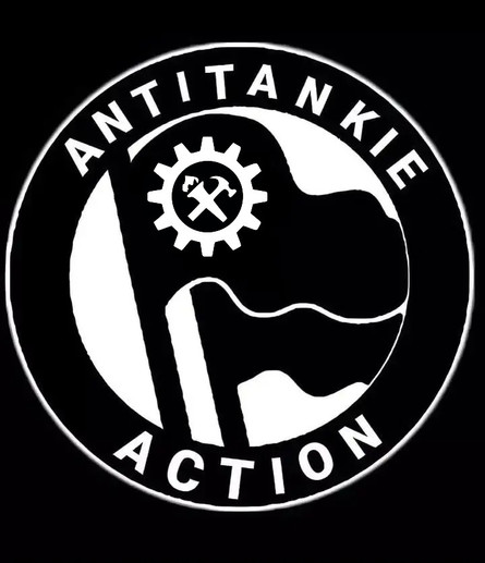 Black and white logo with bold text "ANTITANKIE ACTION." Features crossed syndicalist symbol inside a gear, overlapping two waving flags. 
