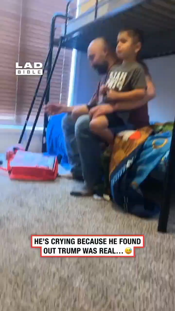 A boy sits on a bunk bed beside what appears to be his father. The boy says, “Donald Trump is a real person.” A girl responds, “Yes, Donald Trump is a real person.” The boy starts crying, and his father says, “I feel you, bud.”