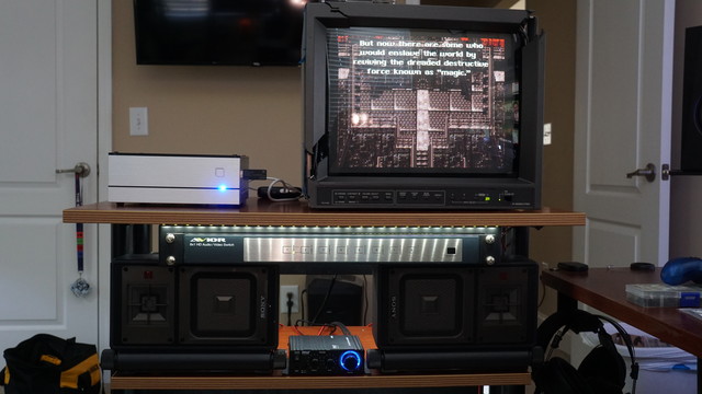 A set of Sony APM-X5A speakers connected to a cheap Pyle stereo amp.  The SCART breakout cable's RCA audio outputs go into the amp, and the RGB connectors go into the back of the JVC CRT.  The screen is showing Final Fantasy 6 being played on the MiSTer beside it.