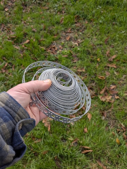 A reel of metal banding with no clearly defined purpose