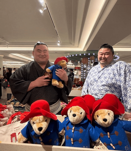 sumo wrestlers with Paddington the bear