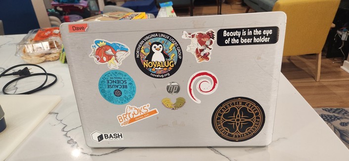 Northern Virginia Linux User Group sticker on an eleven year old laptop.