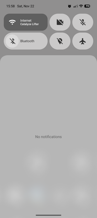 A smartphone screen showing a light-themed control panel with time, date, network, battery status, and icons for Wi-Fi, Bluetooth, and settings.