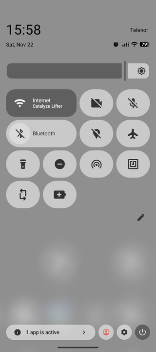 A smartphone screen showing a light-themed control panel with time, date, network, battery status, and icons for Wi-Fi, Bluetooth, and settings.