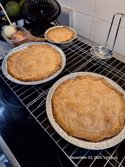 Three pies cooling.