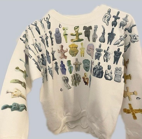 sweater showcasing lots of ancient sculptures of the female figure