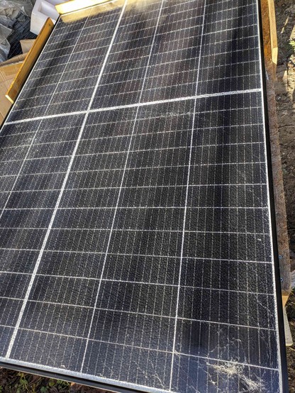 a shattered solar panel covered in urethane sealant