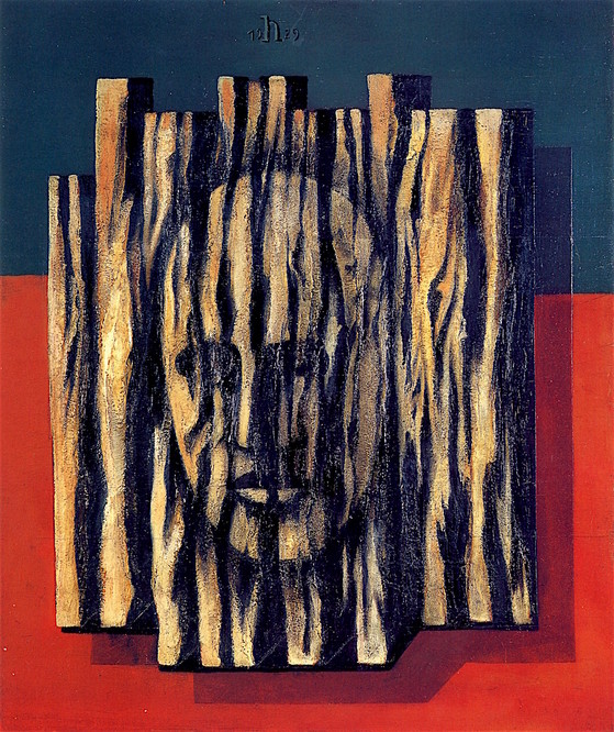 face in the cut out tree bark