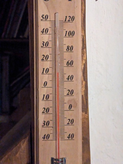 A thermometer reading 12°C / 52°F