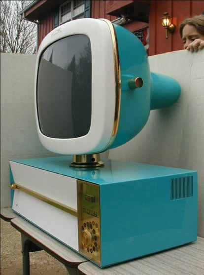 old TV, various textures, CRT is above on a separate pivoting fixture from the main box. three distinct materials in use. tactile knob on the right of the box, speaker grill on the rear side.