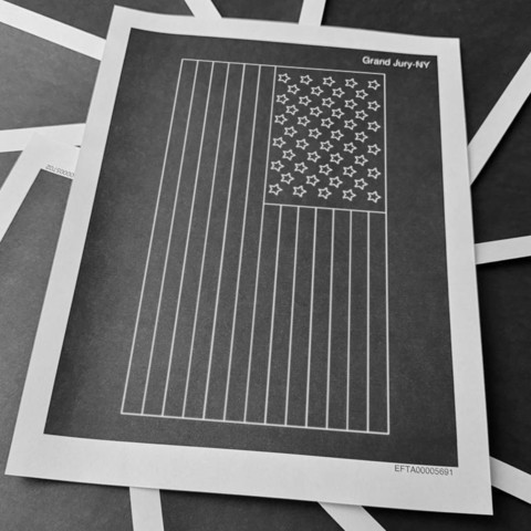 A black American flag created from one of the hundreds of fully redacted pages from the Epstein files release by the regime.