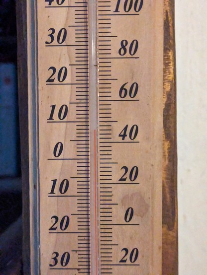 A thermometer inside a house reading 8°C / 46°F