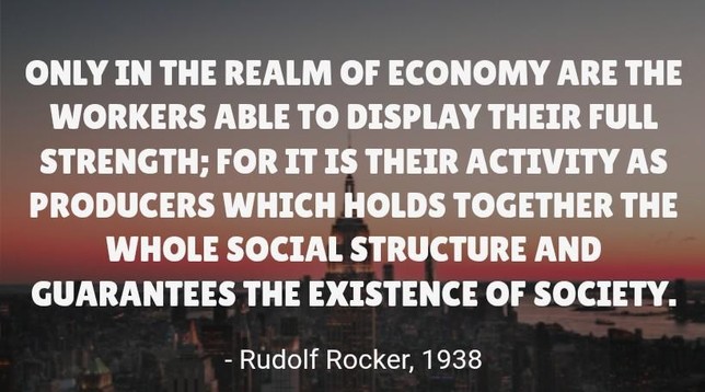 White bold text over a dusk city skyline reads: ‘Only in the realm of economy are the workers able to display their full strength; for it is their activity as producers which holds together the whole social structure and guarantees the existence of society.’ Attribution below: Rudolf Rocker, 1938.
