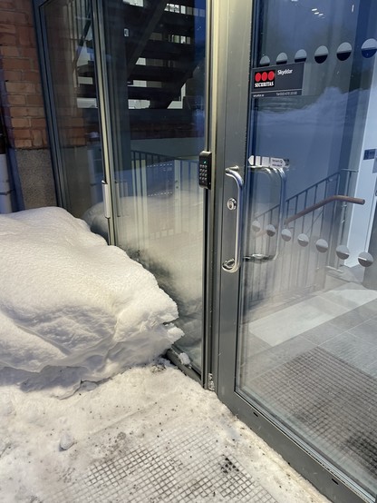 A picture showing a door opener in a place where the weel chair can not access it