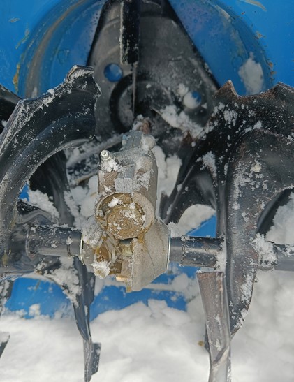 Broken auger on a snowblower. 