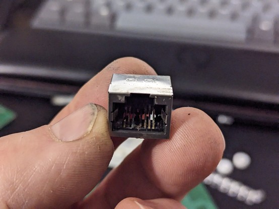 An ex-RJ45 port thoroughly rotted with corrosion