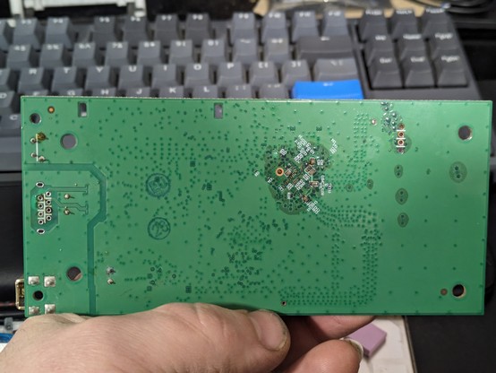 PCB showing signs of corrosion under the solder mask (reverse)