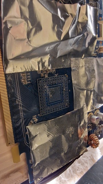 The gpu board with the core taken off. On top-left you can see 4 broken pads.