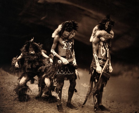 Three Navajo men proceeding as war gods