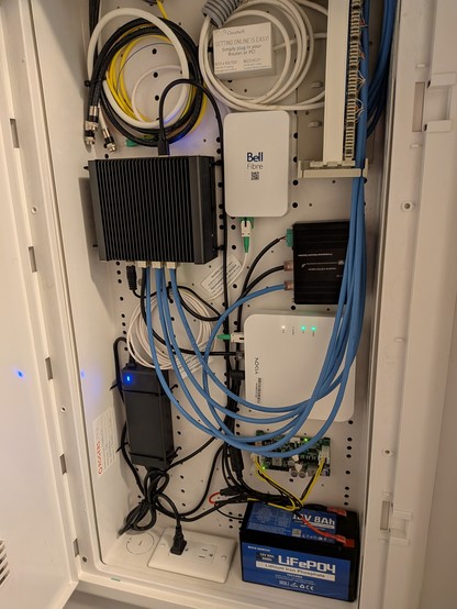 Photo of my networking closet with a UPS as an addition.