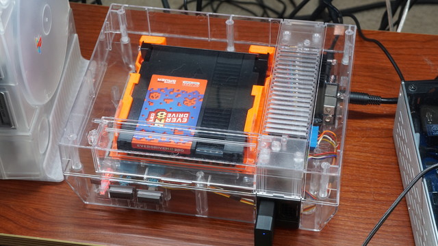 The NES put back together and connected to the PVM via RGB out and a 12V DC power brick.  The Everdrive N8 Pro cartridge is loaded into the slot.