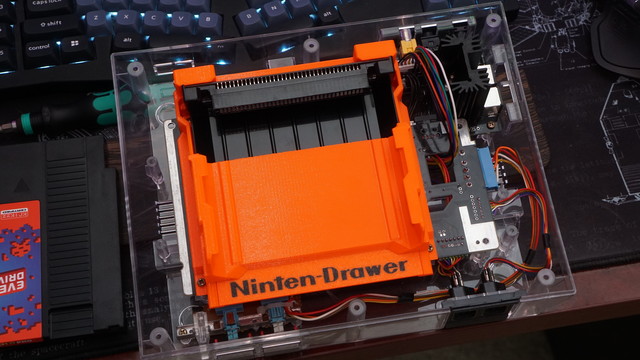 The Ninten-drawer installed on top of the NESessity v1.4 board with four screws.