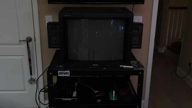 The Sony PVM sitting on an AV rack underneath a TV.  Not a great photo.