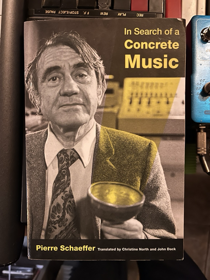 A book about Pierre Shaeffer with his face on the cover; yellow font "In Search of a Concrete Music"