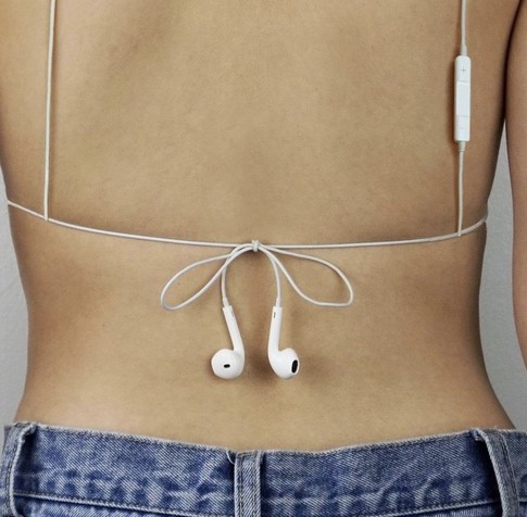 her bra is partially made of tied earbuds