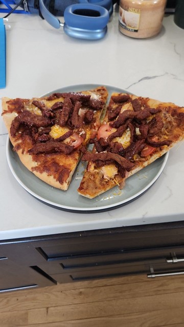 Two slices pizza with spicy korean marinated beef