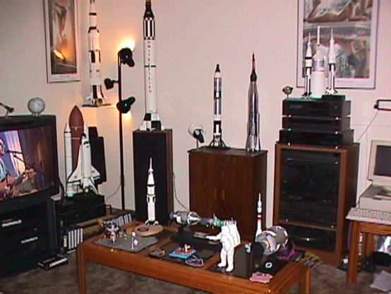 living room full of model rockets and astronaut and space memorabilia 